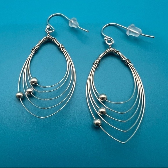 Multi Hoops with moving silver balls dangle earrings. - Picture 11 of 12